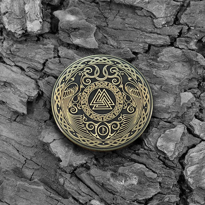 Viking Valknut brass coin on a natural bark background, highlighting the aged patina and ancient Nordic symbolic aesthetic.