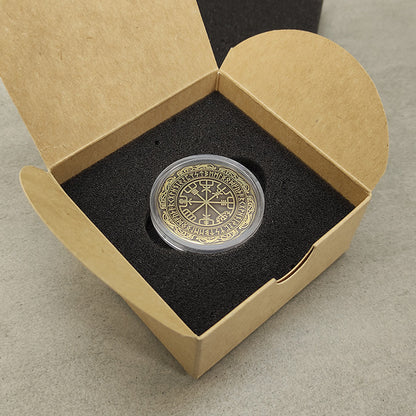 Vegvisir brass coin in an acrylic capsule inside a gift box with foam insert.