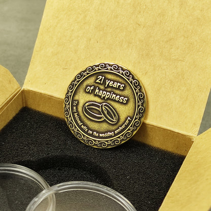 Handmade brass anniversary souvenir coin for her placed in a stylish gift box with black foam insert, unique 21st wedding anniversary gift.