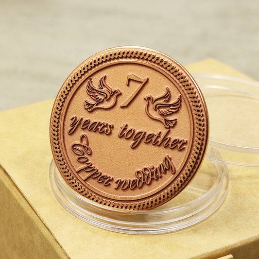7th wedding anniversary copper coin with deep engraving of doves and number 7, "7 years together" personalized gift, polished copper finish.
