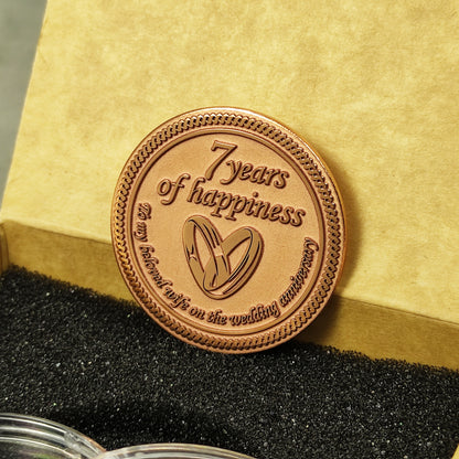 Hand-polished copper anniversary coin with "7 years of happiness" text, personalized wedding date engraving, high-quality metalwork.