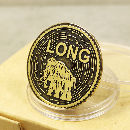 Polished brass decision making coin with deep engraved mammoth and "LONG" text on a black patina background.