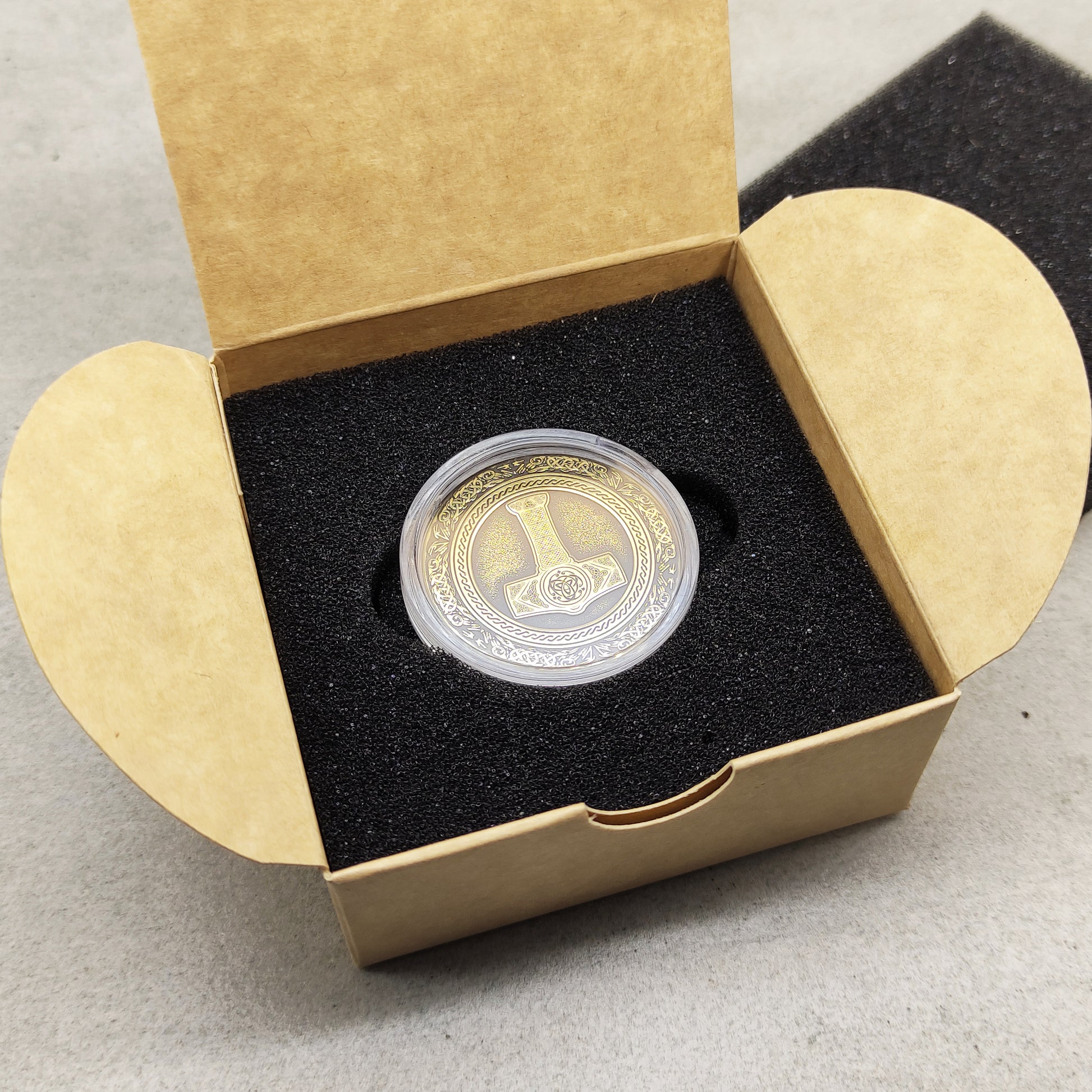 Thor's Hammer brass talisman in a protective acrylic capsule and craft gift box.