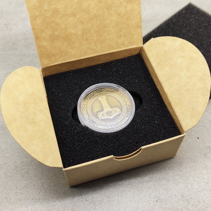 Thor's Hammer brass talisman in a protective acrylic capsule and craft gift box.