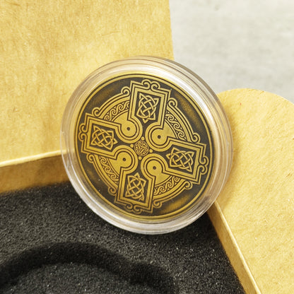 Custom engraved Celtic brass amulet in a protective acrylic capsule and craft gift box, unique spiritual gift presentation.