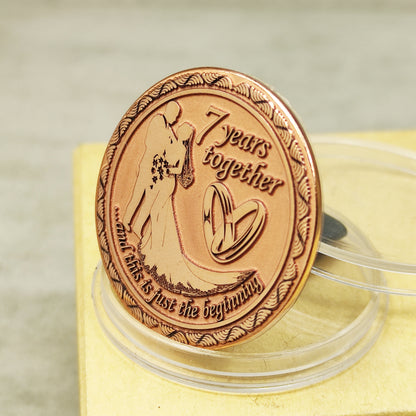 Pure copper 7th anniversary souvenir coin, personalized romantic gift with decorative border and glossy polished surface, obverse view.