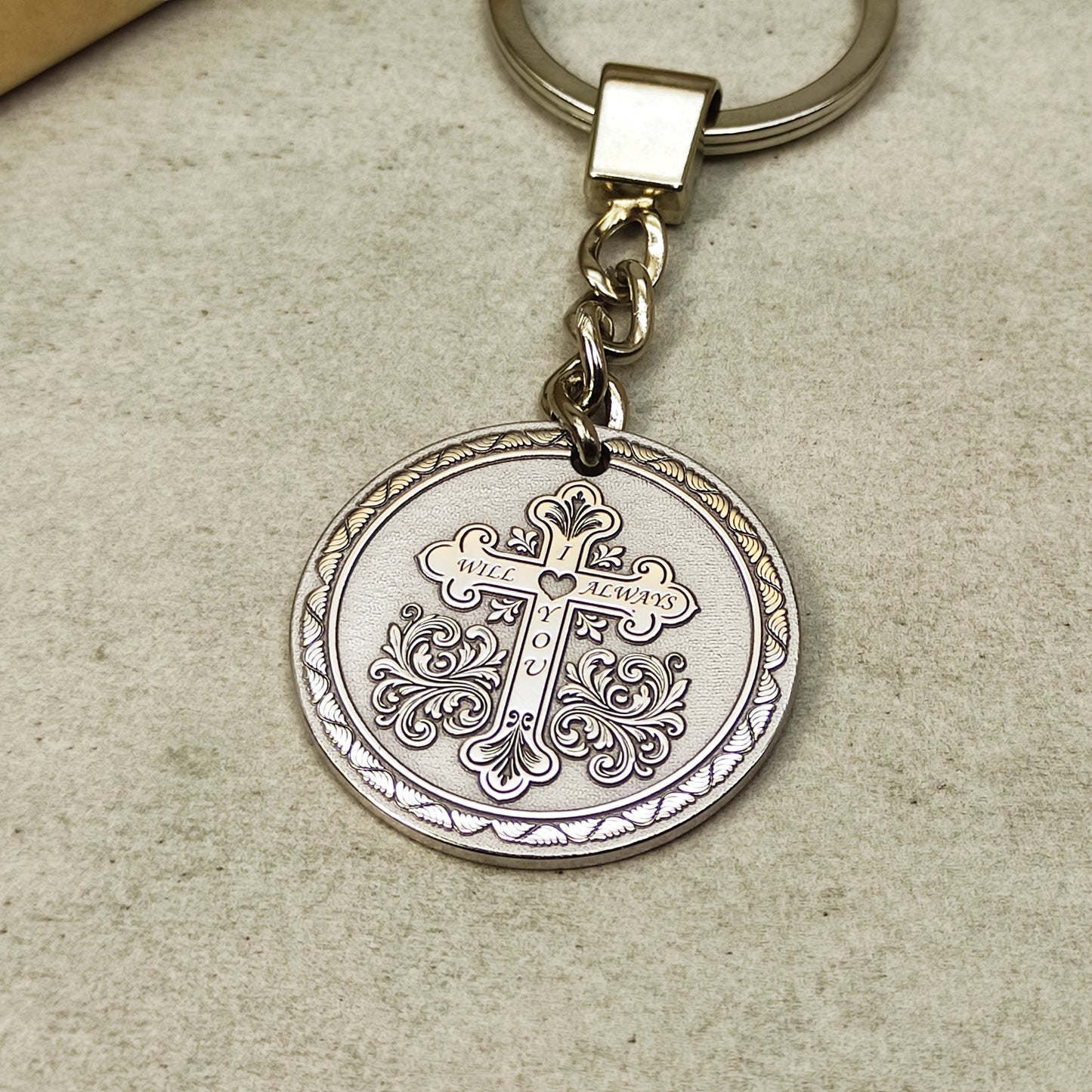 Round stainless steel medallion keychain with detailed orthodox cross laser engraving.