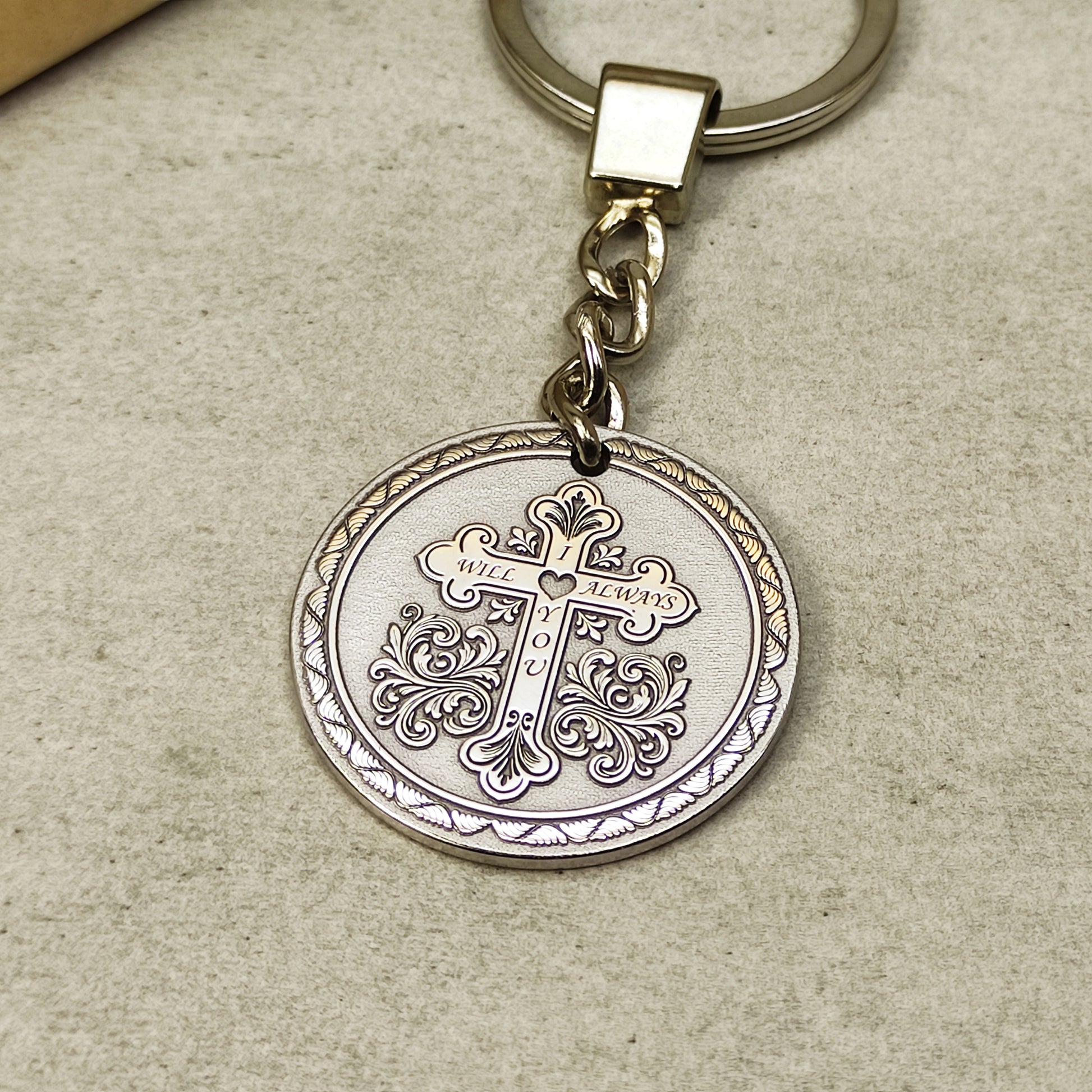 Round stainless steel medallion keychain with detailed orthodox cross laser engraving.
