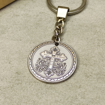 Round stainless steel medallion keychain with detailed orthodox cross laser engraving.