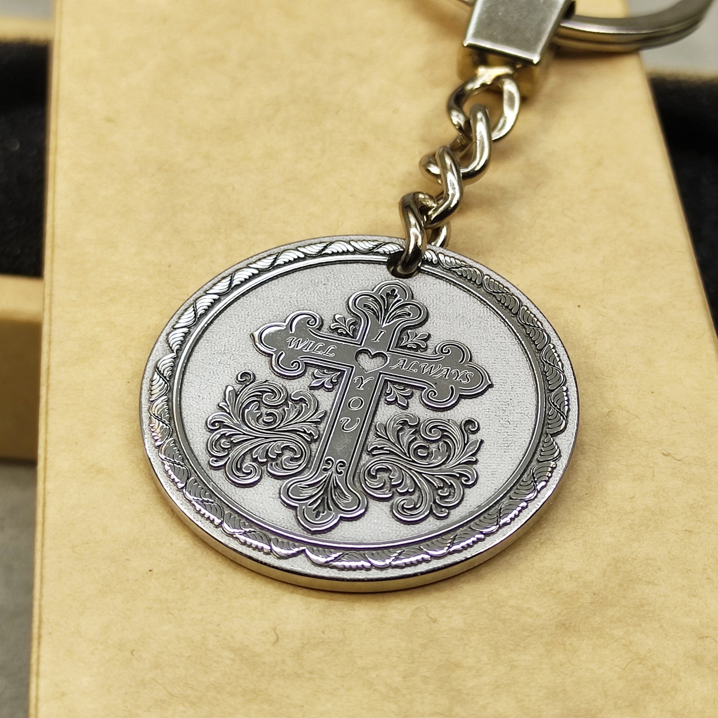 Durable stainless steel souvenir keychain with intricate engraved pattern and high-quality metal ring.