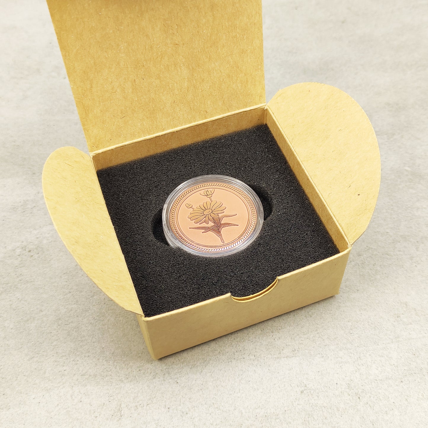 Aesthetic presentation of the copper flower medal in a craft box, ideal for a 7th wedding anniversary gift or personalized keepsake.