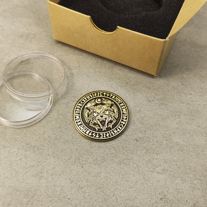 Perspective view of a 2mm thick brass challenge coin, showcasing the golden luster and precision of the Viking wolf design.