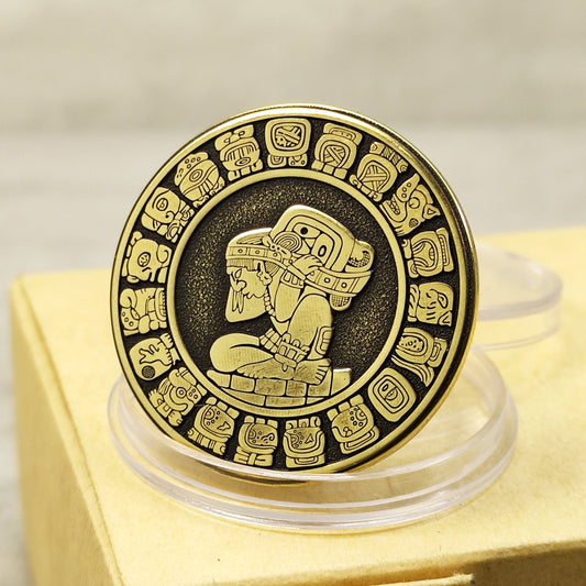 Detailed brass Mayan calendar coin with Tzolkin and Haab symbols, deep laser engraved souvenir with high-contrast black patina.