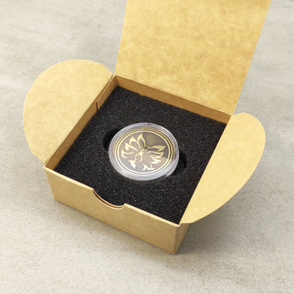Custom engraved nine-tailed fox brass coin in a protective case inside a minimalist gift box, showing full presentation.