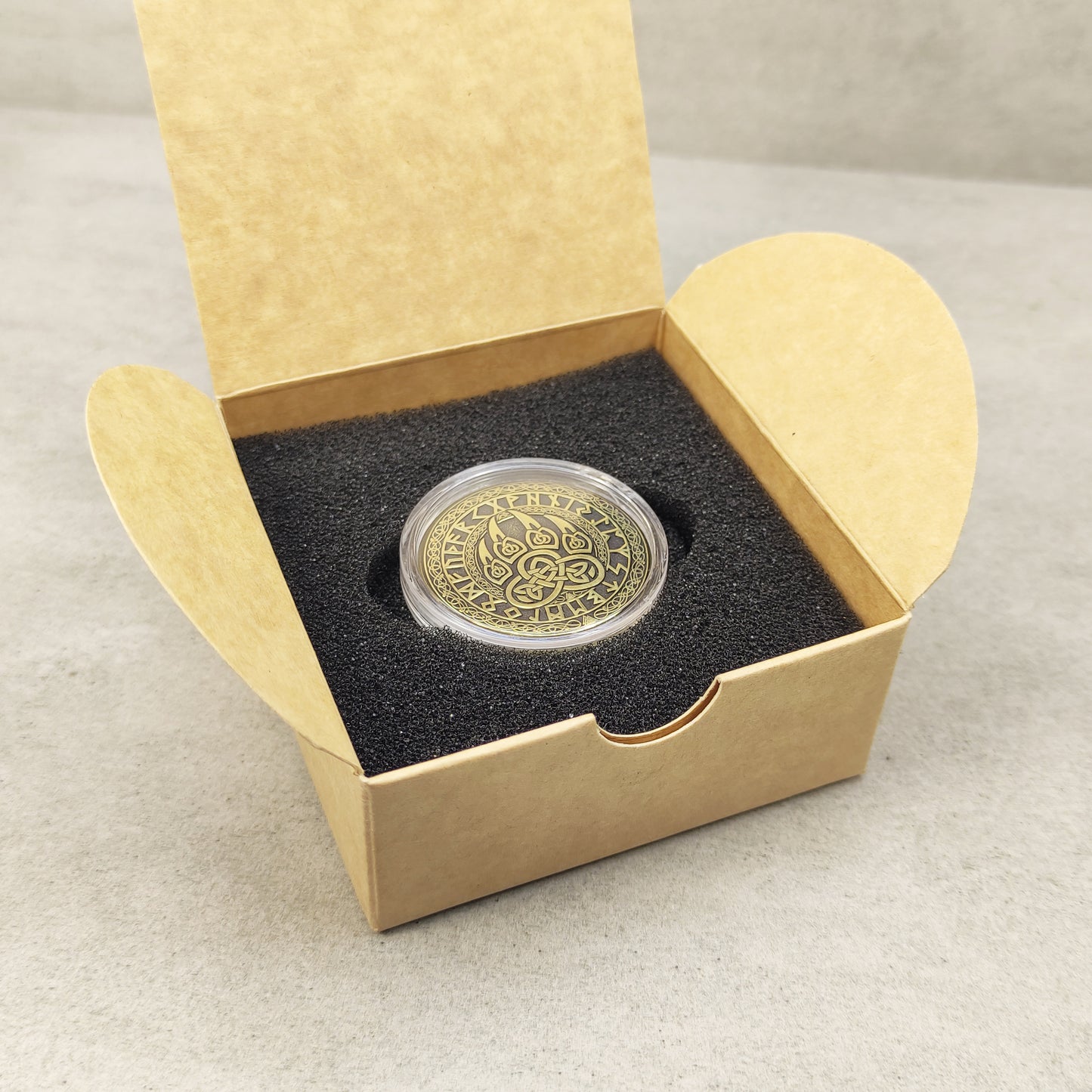Handmade brass zodiac coin Bear Paw safely stored in a gift box with foam insert.