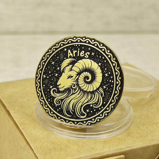 Close-up of Aries zodiac brass medal with deep laser engraving of a ram head, features antique dark patina finish and decorative celestial border.