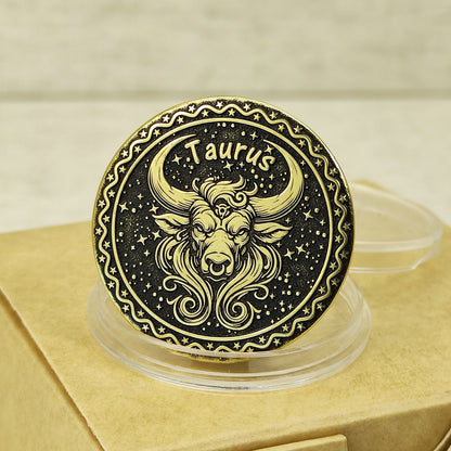 Close-up of Taurus zodiac brass medal with deep laser engraving of a bull head, features antique dark patina finish and decorative celestial border.