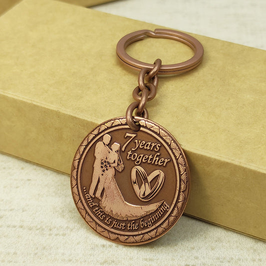 7th wedding anniversary copper keychain with deep engraving of a couple, "7 years together" personalized gift, antique copper finish.