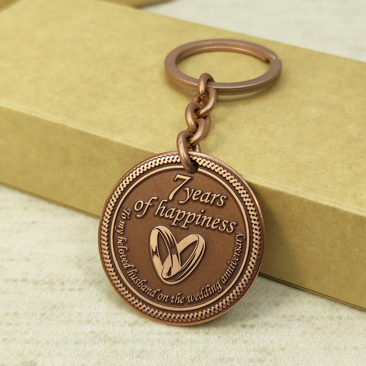 7th wedding anniversary copper keychain for husband, "7 years of happiness" engraved coin gift with wedding rings, antique copper finish.