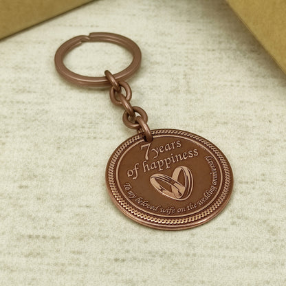 Hand-polished copper anniversary keychain with "To my beloved wife" text, personalized wedding date engraving, high-quality metalwork.