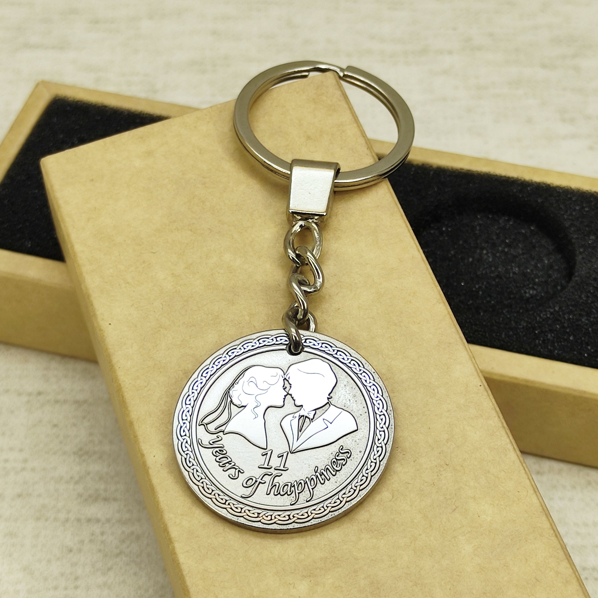 Side view of the personalized stainless steel anniversary coin keychain, showcasing the thickness and premium metal quality of the 11-year wedding gift.