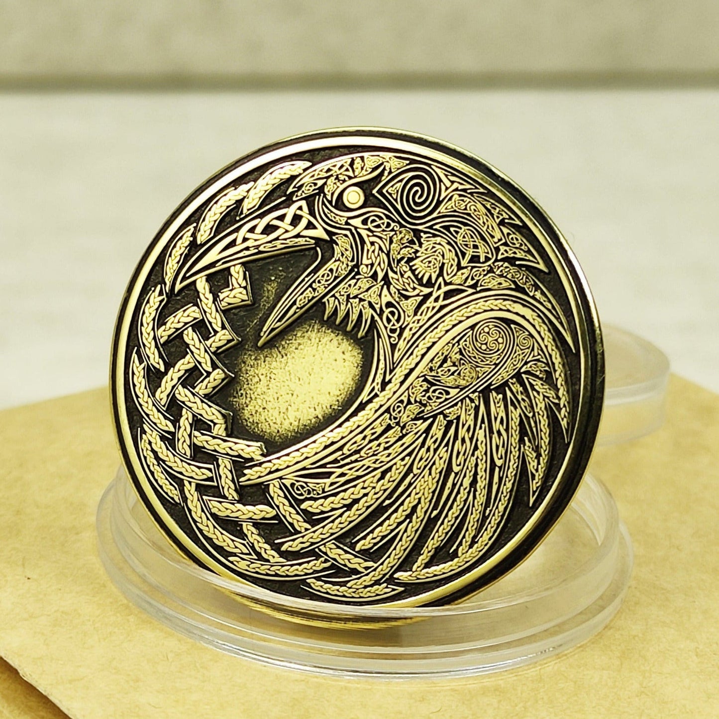 Custom brass coin with Odin's Raven Huginn and Muninn engraving, 32mm diameter, deep laser etching with black patina.