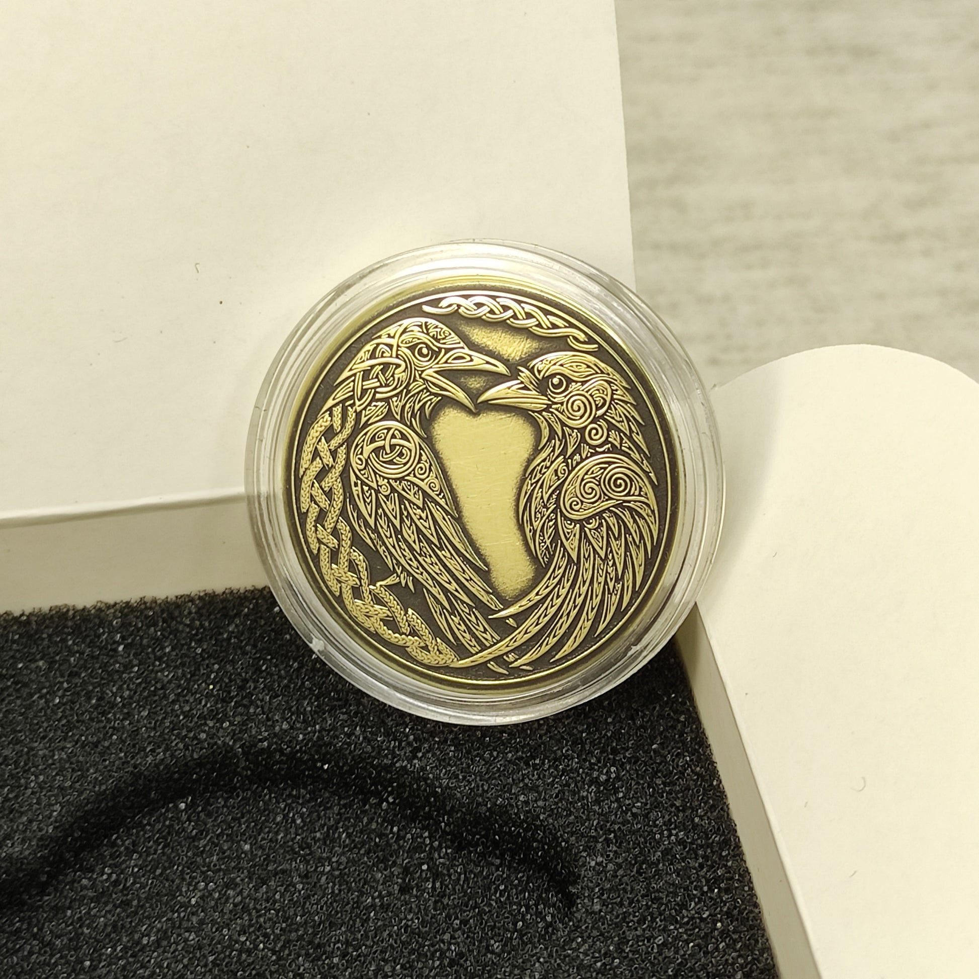 Handcrafted Viking ravens brass coin in a protective capsule and gift box, unique personalized Norse talisman for protection.
