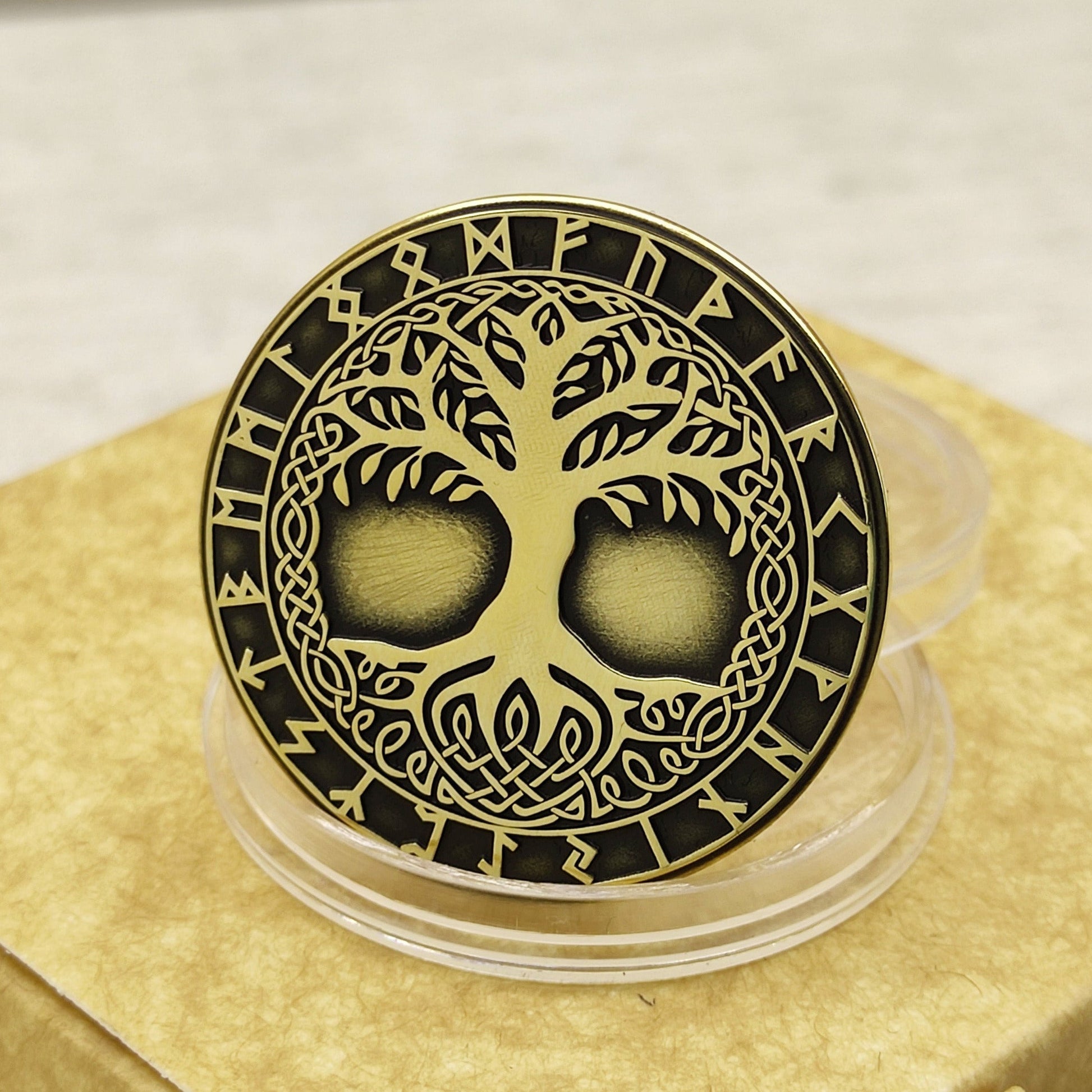 Handcrafted brass coin with Tree of Life Yggdrasil engraving, 32mm diameter, deep black patina and Nordic rune circle.