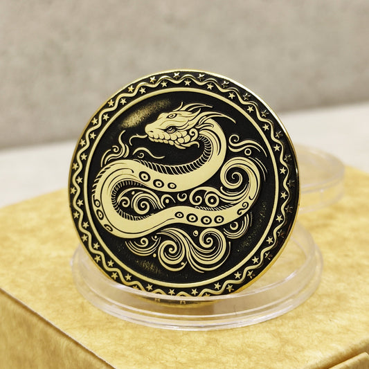Close-up of a brass Chinese zodiac coin Year of the Snake, featuring deep laser engraving, antique patina finish, and decorative star border on a gift box.