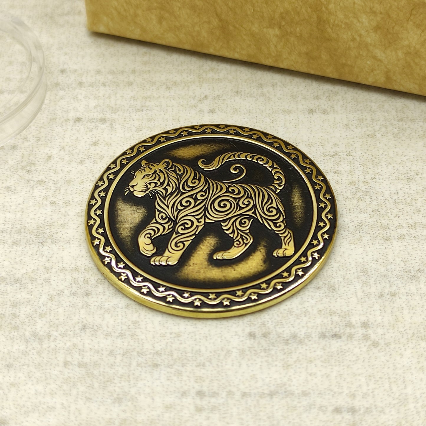 Detailed view of the brass Tiger zodiac coin with 3D-style floral patterns, showcasing the 32mm diameter and professional deep laser etching.