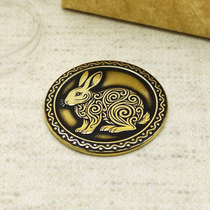 Detailed view of the brass Rabbit zodiac coin with 3D-style floral patterns, showcasing the 32mm diameter and professional deep laser etching.