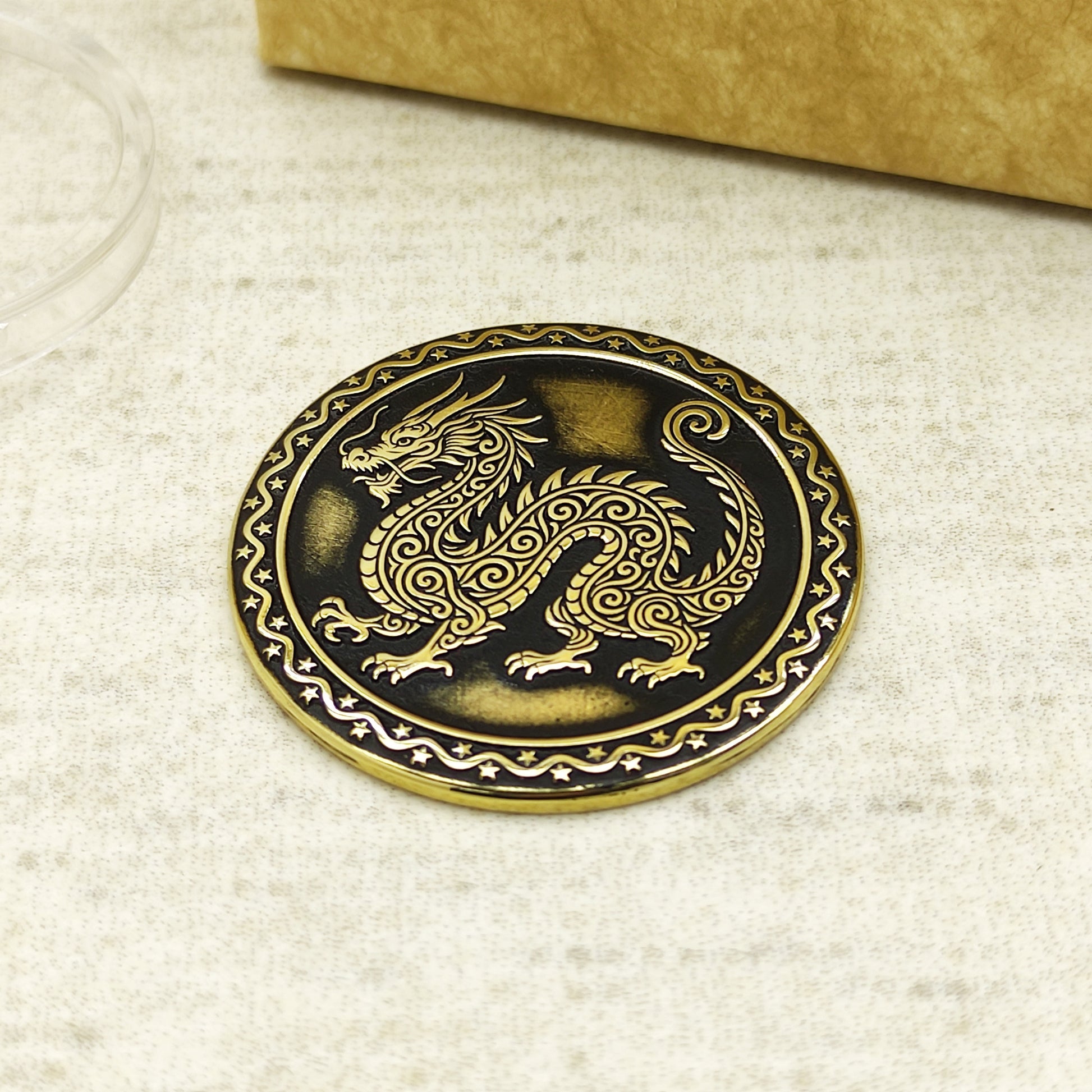 Detailed view of the brass Dragon zodiac coin with 3D-style floral patterns, showcasing the 32mm diameter and professional deep laser etching.