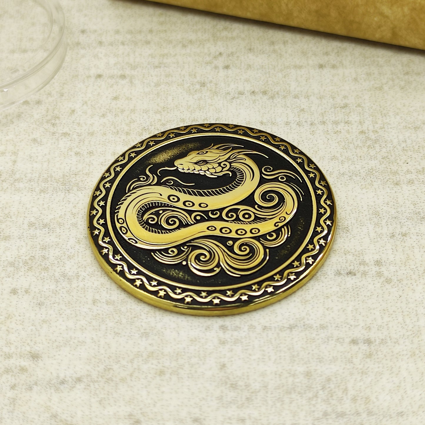 Detailed view of the brass Snake zodiac coin with 3D-style floral patterns, showcasing the 32mm diameter and professional deep laser etching.