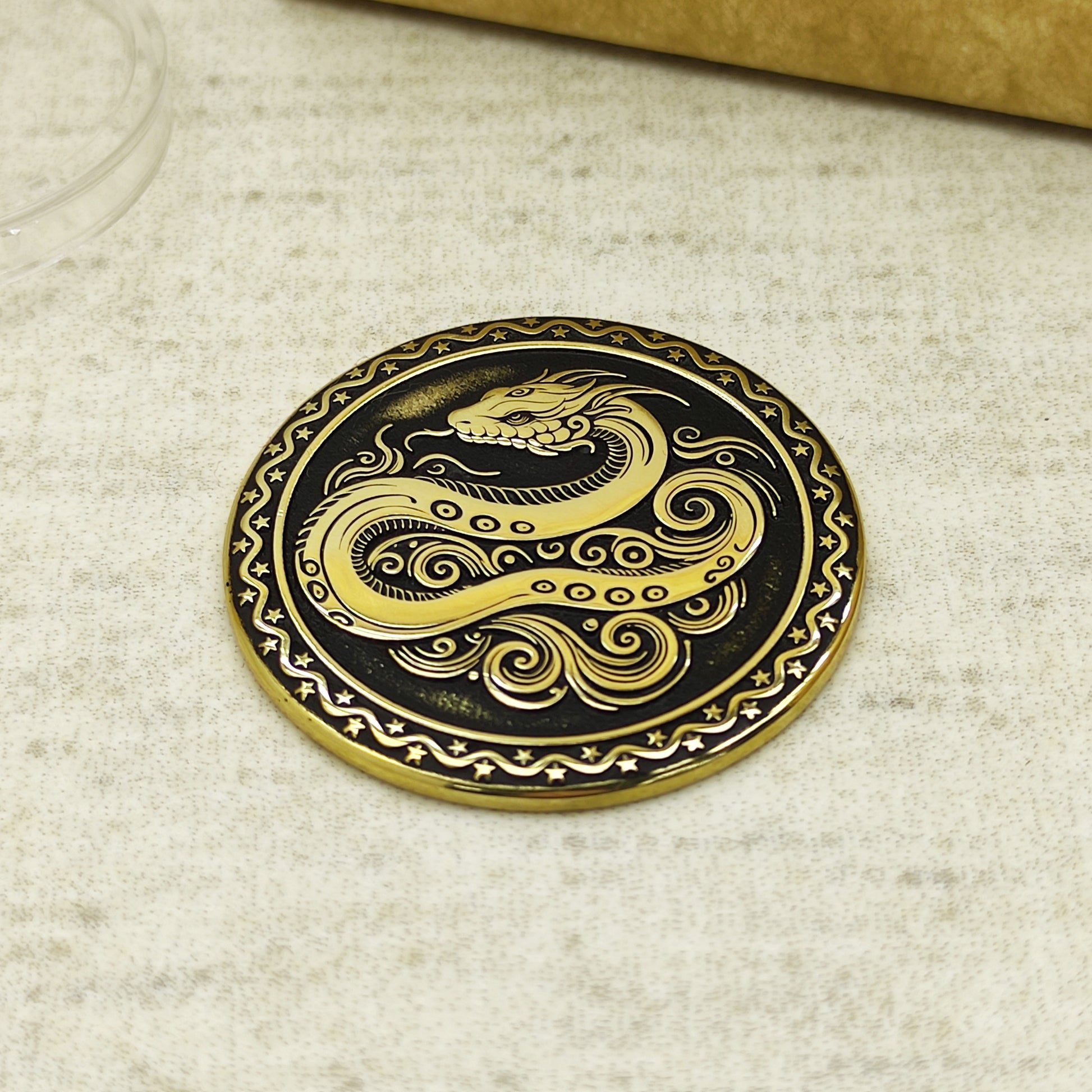 Detailed view of the brass Snake zodiac coin with 3D-style floral patterns, showcasing the 32mm diameter and professional deep laser etching.
