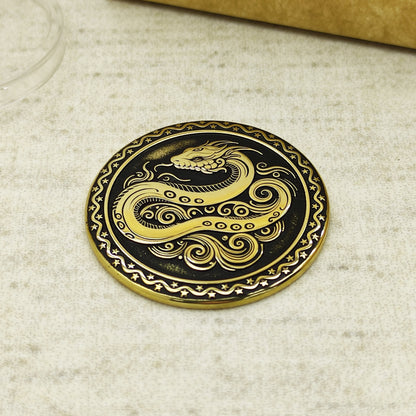 Detailed view of the brass Snake zodiac coin with 3D-style floral patterns, showcasing the 32mm diameter and professional deep laser etching.