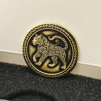 Vertical view of the personalized brass zodiac medal in a premium black insert box, showcasing the antique finish and engraved zodiac details.