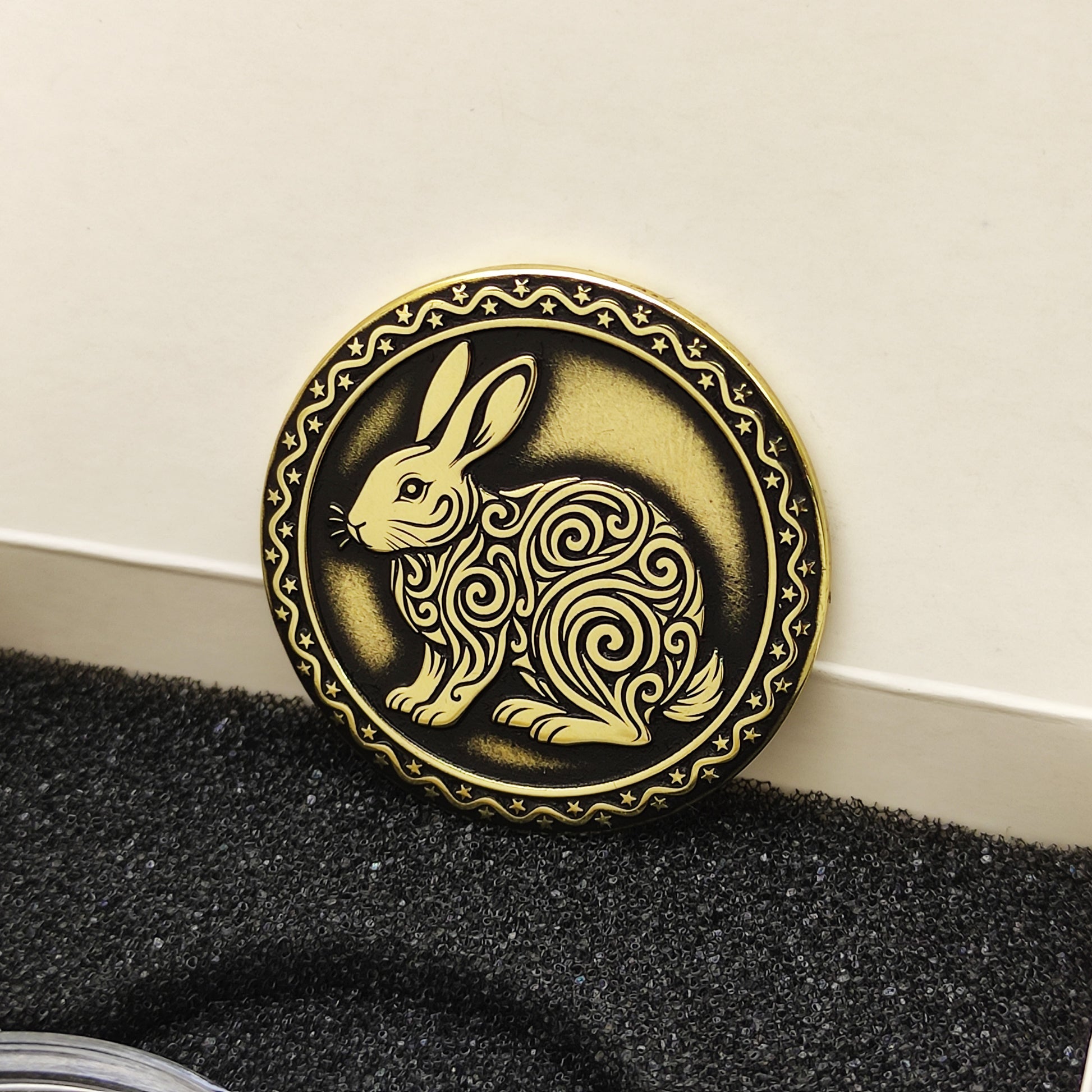 Vertical view of the personalized brass zodiac medal in a premium black insert box, showcasing the antique finish and engraved zodiac details.