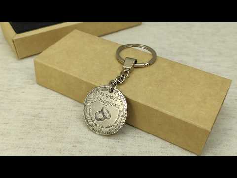 Personalized brass coin keychain for 11 year anniversary, showcasing the durable metal surface with antique patina finish, handcrafted anniversary gift for him.