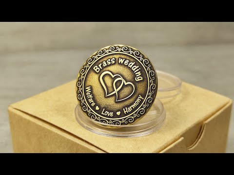 Video showcase of custom engraved brass anniversary gift coin in a protective acrylic capsule and eco-friendly gift box.