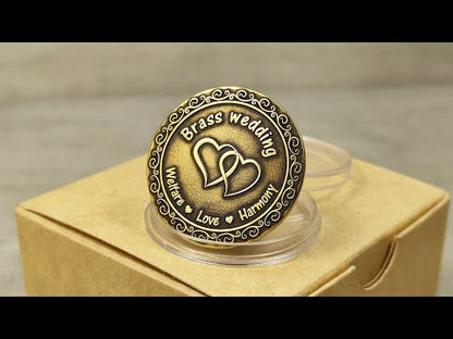 Video showcase of custom engraved brass anniversary gift coin in a protective acrylic capsule and eco-friendly gift box.