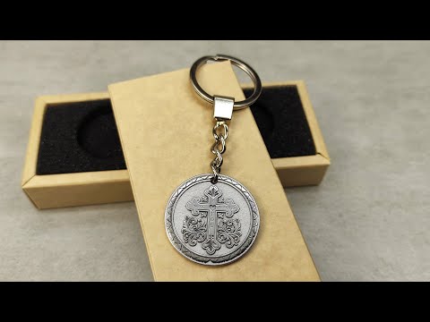 Custom engraved stainless steel religious keychain with protective cross symbol and metallic finish.