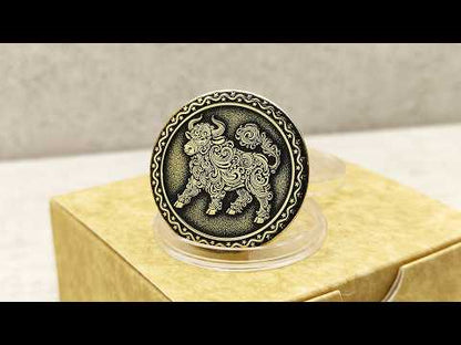 Video showcase of a personalized brass zodiac coin Year of the Ox, highlighting the metallic gold-tone texture and high-contrast professional patina.